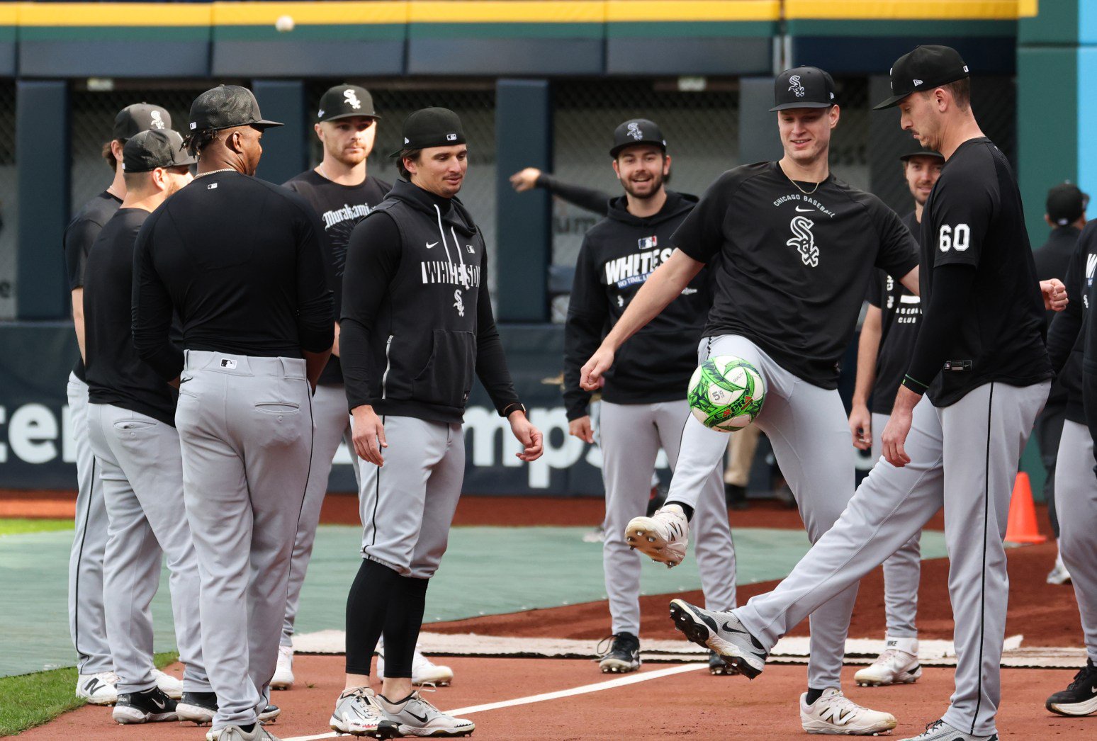 White Sox pitchers warm up with a soccer ball before Game 1 of the AL Division Series against the Guardians on Oct. 3 in Cleveland. (John J. Kim/Chicago Tribune)