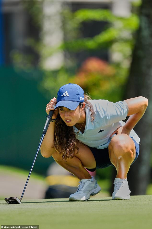 Julia Lopez Ramirez of Spain lines up a putt on the eighth hole during the second day of LPGA Maybank Championship in Kuala Lumpur, Malaysia, Friday, Oct. 30, 2026. (AP Photo/Vincent Thian)