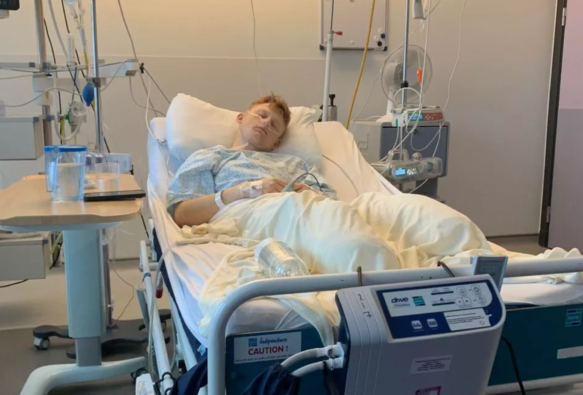 Adam Golebiewski in a hospital bed