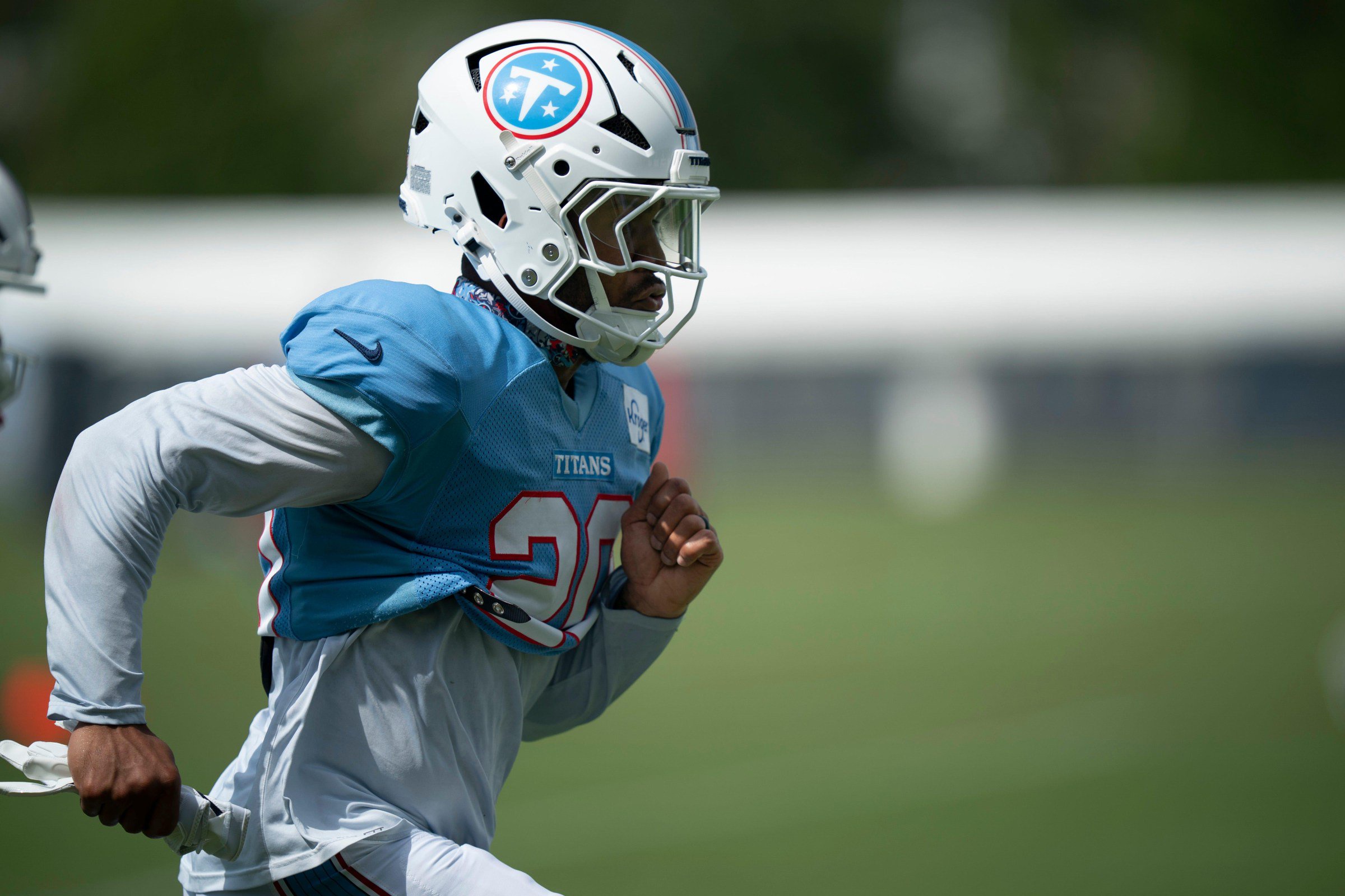 Tennessee Titans running back Tony Pollard (20) goes through warmups during minicamp at Vanderbilt Health Football Center Tuesday, Aug. 4, 2026.