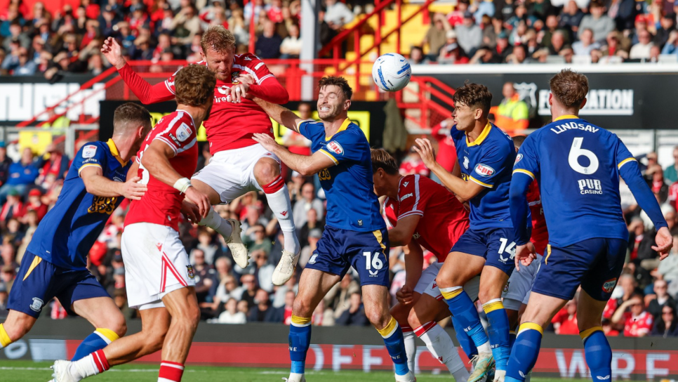 Joe Worrall scores with a header to give Wrexham the lead