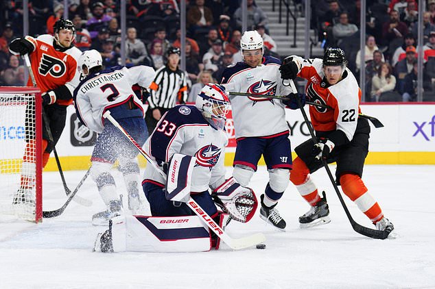 Columbus Blue Jackets goaltender Cam Talbot (33) makes a save during the second period of an NHL hockey game against the Philadelphia Flyers, Tuesday, Oct. 27, 2026, in Philadelphia. (AP Photo/Derik Hamilton)