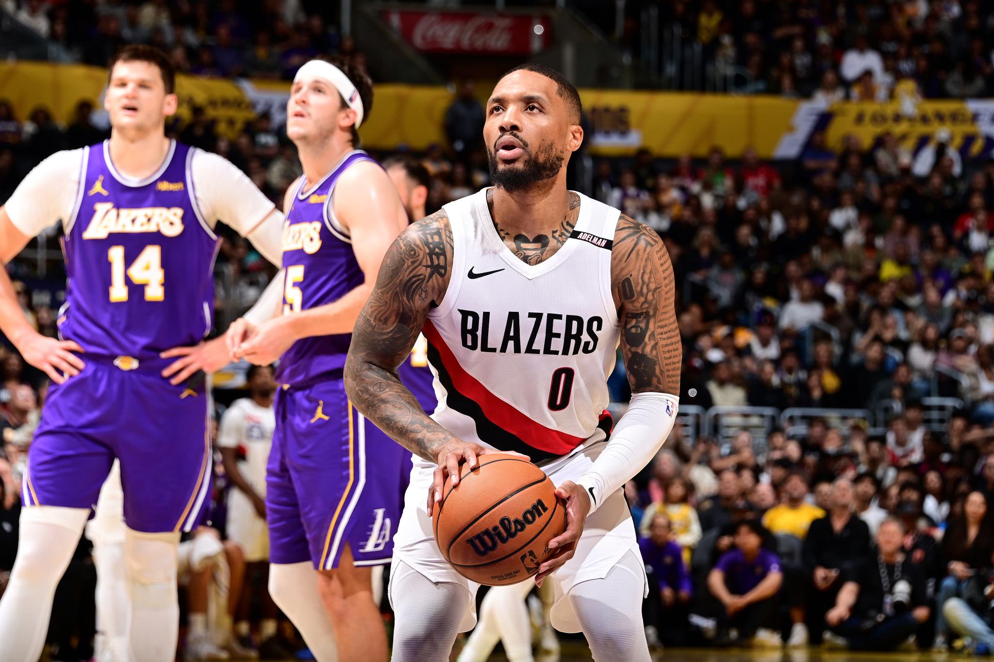 Portland Trail Blazers' Damian Lillard shoots a free throw during an NBA basketball game against the Los Angeles Lakers.