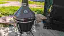 Traeger Grills Ironwood XL lid open sitting on a concrete patio