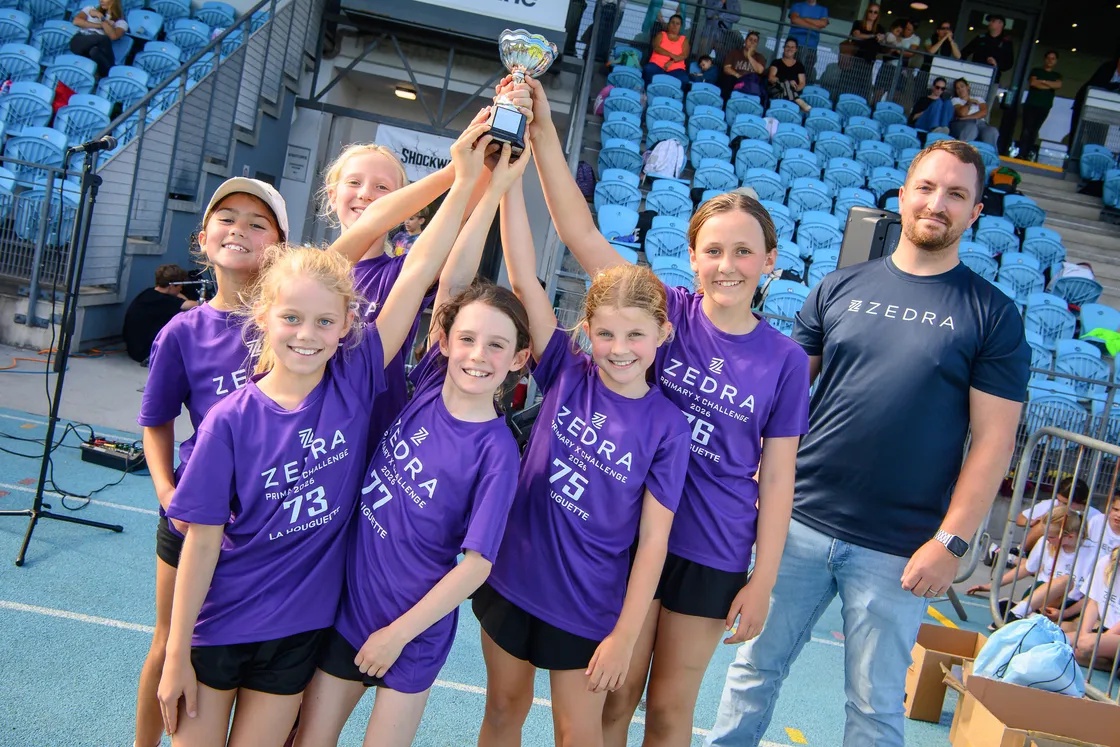 The smiling La Houguette girls celebrate their success in the primary schools’ racing.