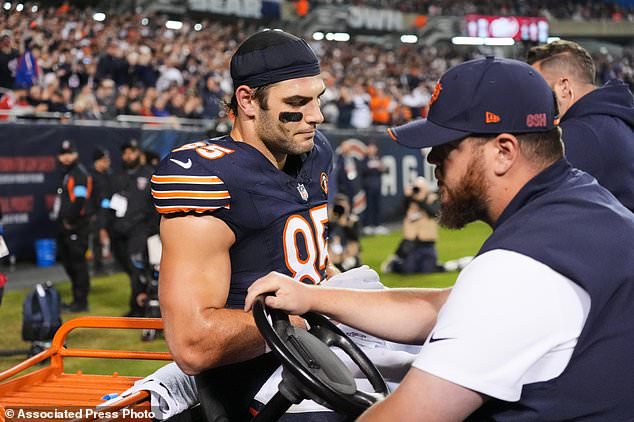 Chicago Bears tight end Cole Kmet (85) is carted off the field after suffering an injury on a pass play during the second half of an NFL football game against the New England Patriots in Chicago, Thursday, Oct. 22, 2026. (AP Photo/Nam Y. Huh)