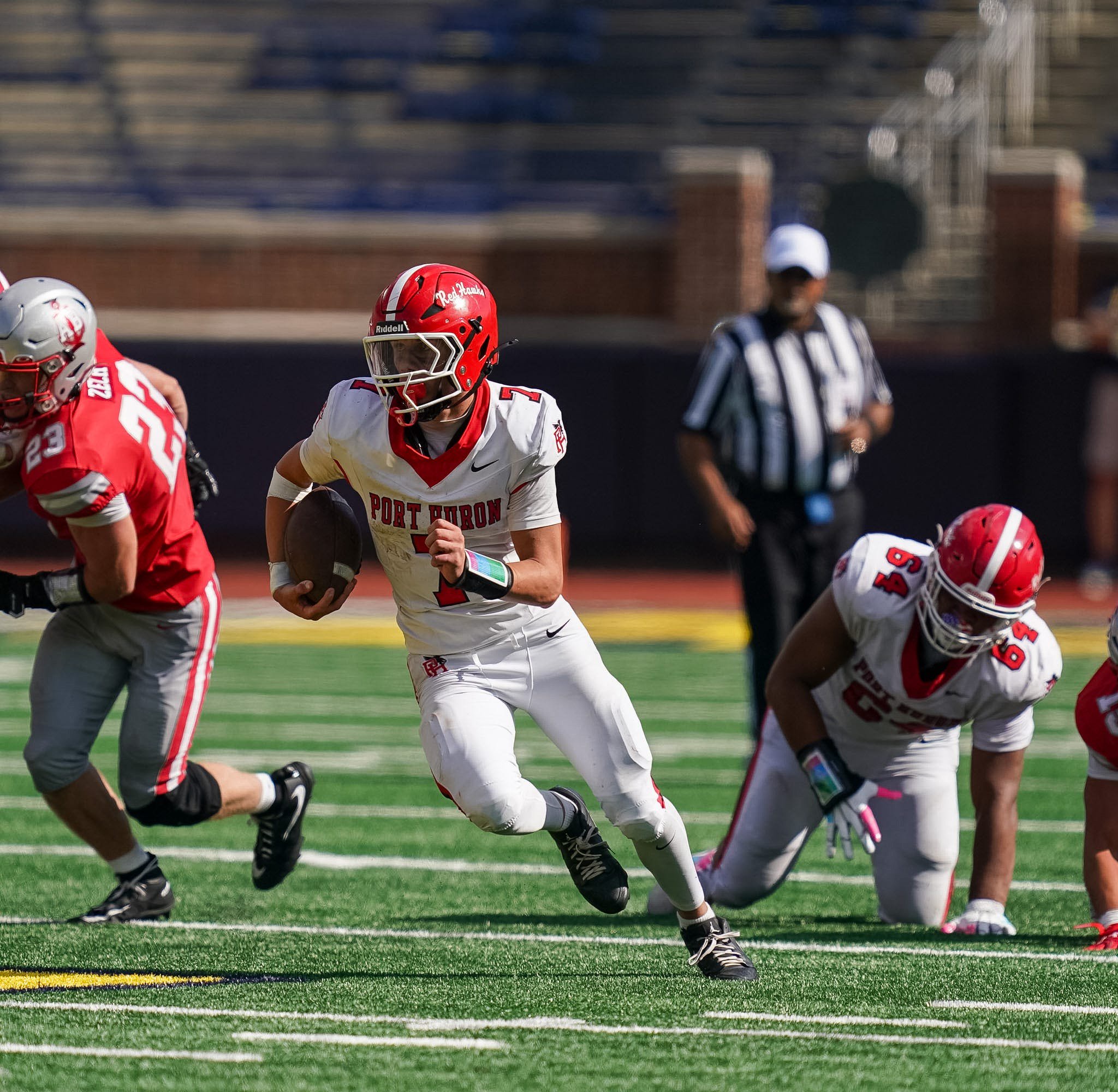 Port Huron quarterback Jax Johnston carries the ball during a game against Anchor Bay at Michigan Stadium in Ann Arbor on Thursday, Aug. 27, 2026.