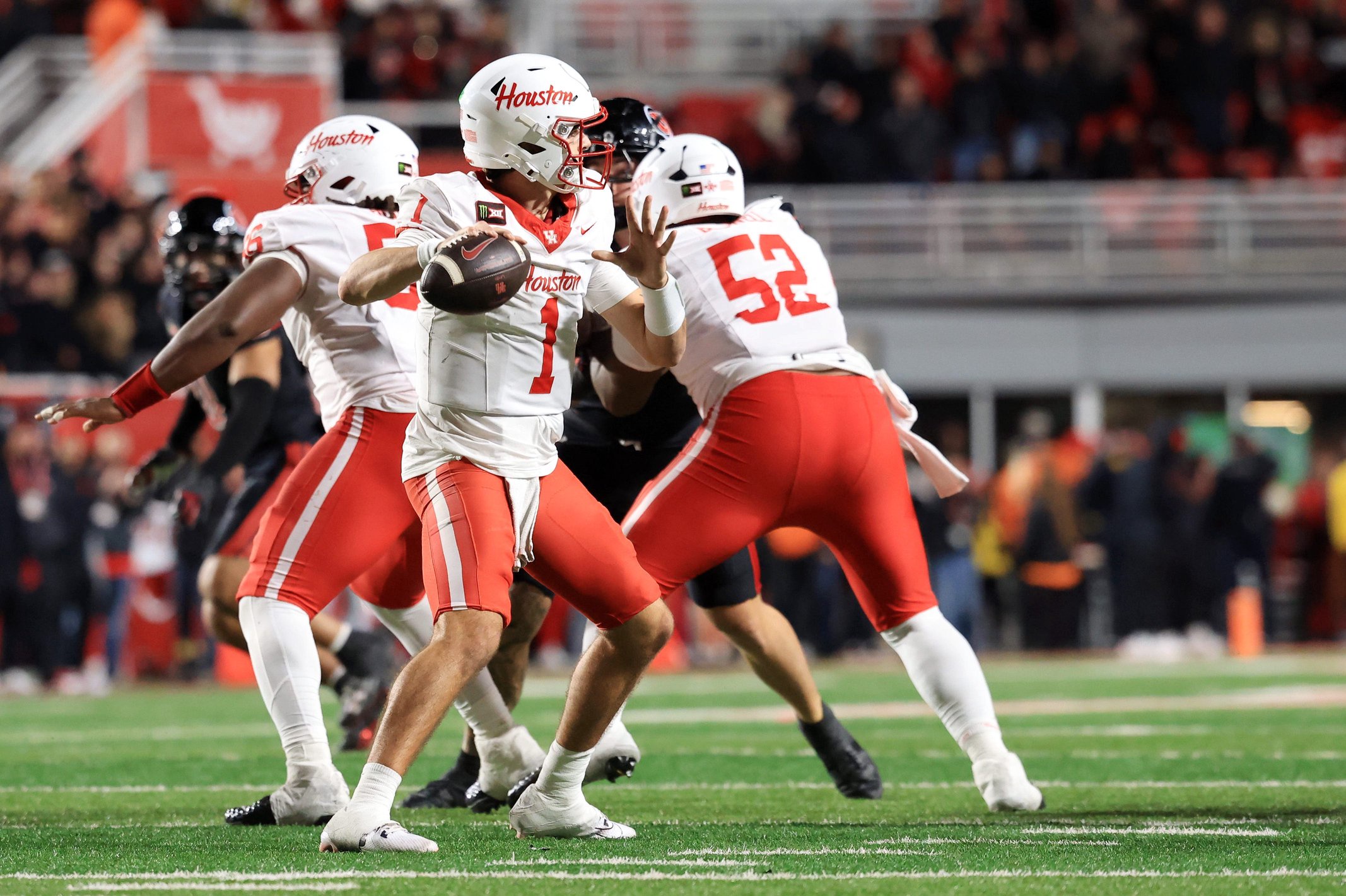 Oct 24, 2026; Salt Lake City, Utah, USA;  Houston Cougars quarterback Conner Weigman (1) throws a pass during the fourth quarter against the Utah Utes at Rice-Eccles Stadium.  Mandatory Credit: Rob Gray-Imagn Images