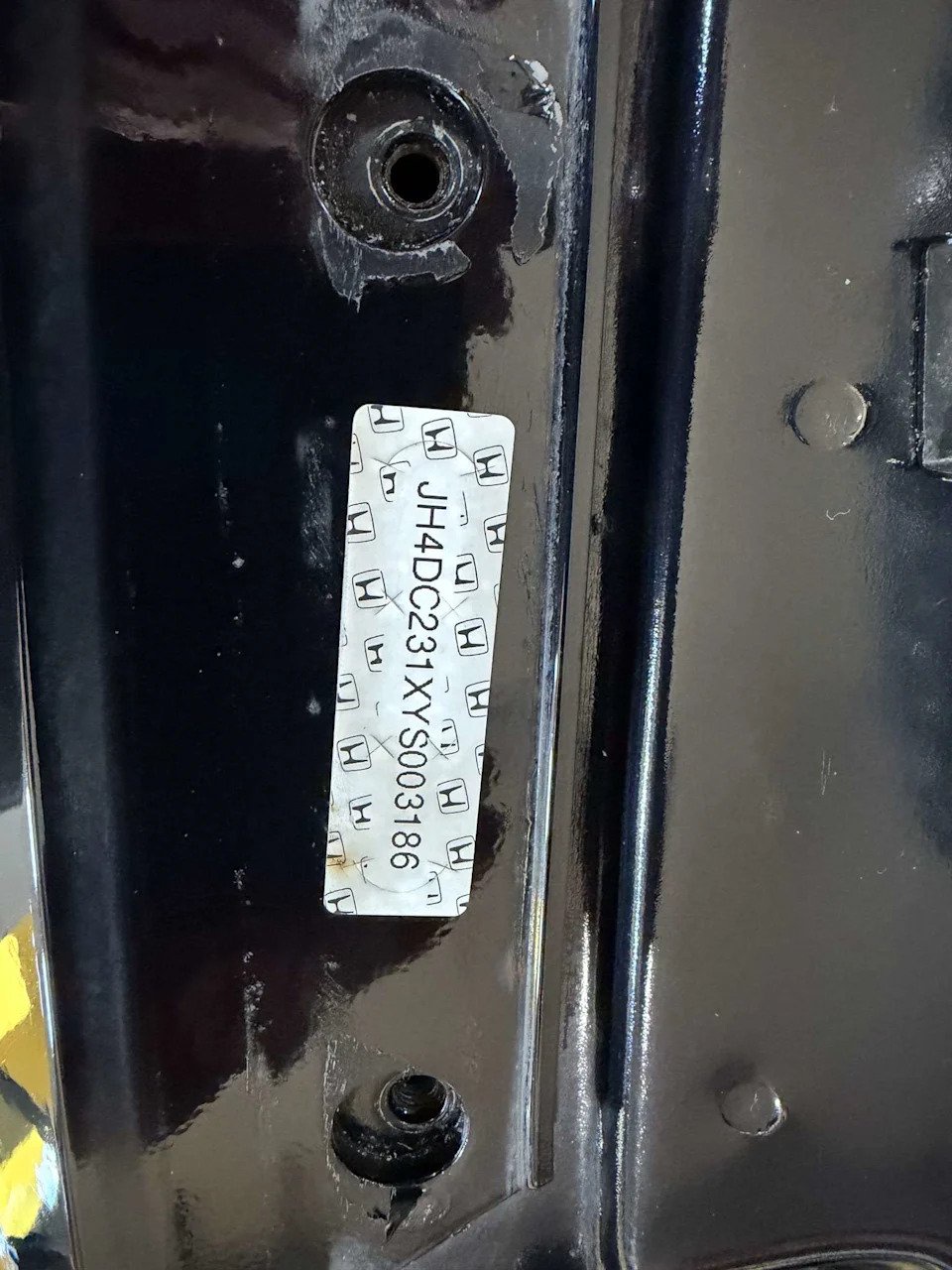 Factory VIN sticker on a body panel of a 2000 Acura Integra Type R