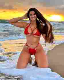 Marie is pictured here wearing a red bikini as she poses on the beach