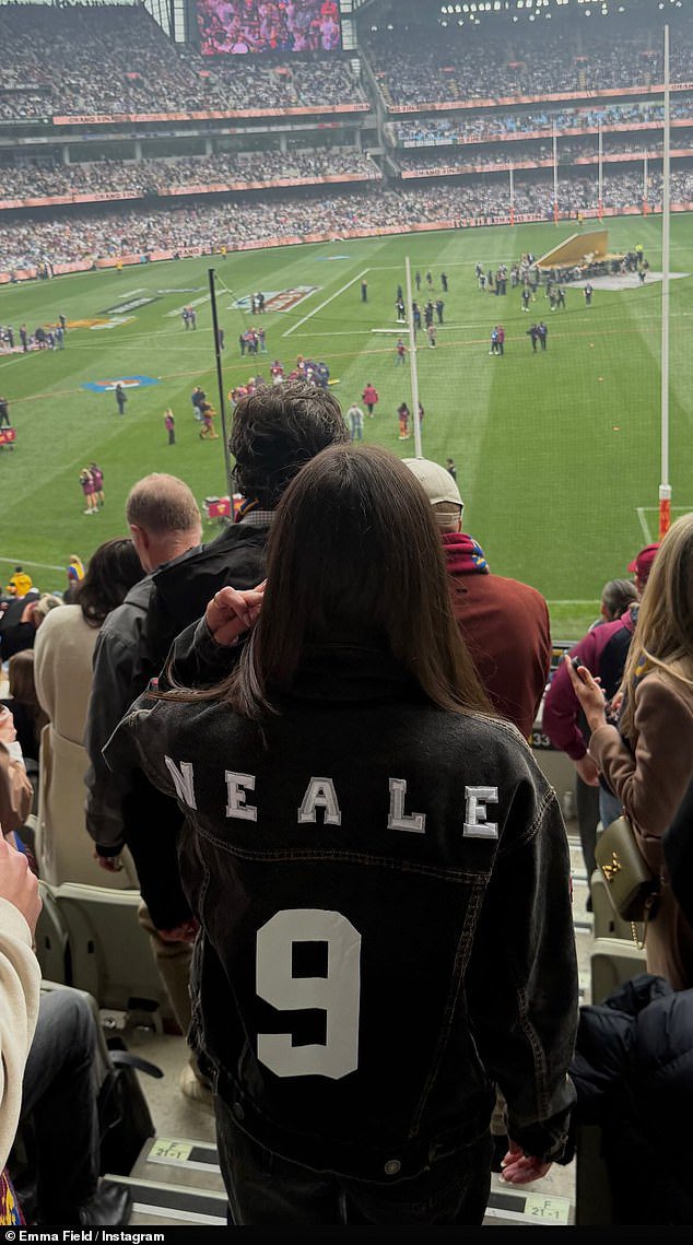 Emma was among the Brisbane Lions supporters cheering on Lachie at September's AFL Grand Final, wearing a personalised 'NEALE 9' jacket (pictured)