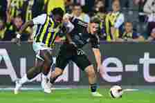 Bright Osayi-Samuel (L) of Fenerbahce in action against Semih Kilicsoy (R) of Besiktas during the Turkish Super Lig week 34 football match between ...