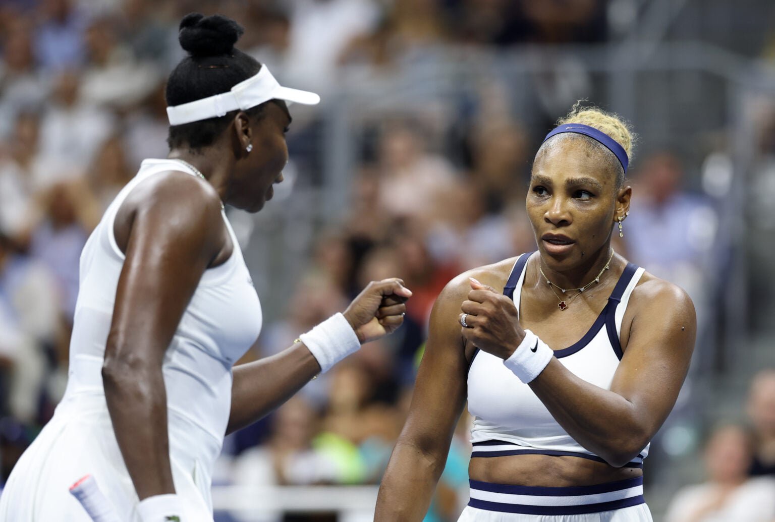 Venus Williams and Serena Williams in action at the US Open.