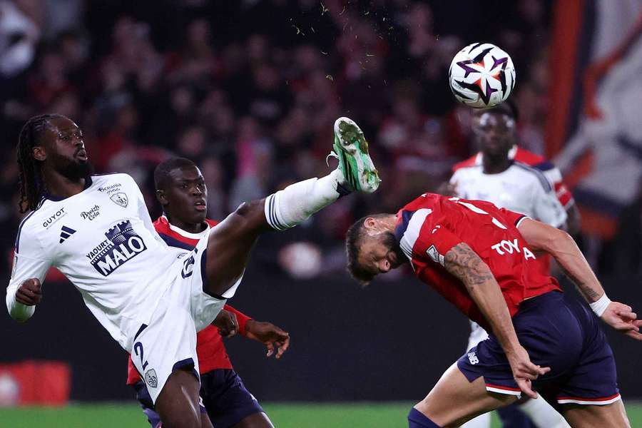 Brest's Bradley Locko battles with Lille's Olivier Giroud 
