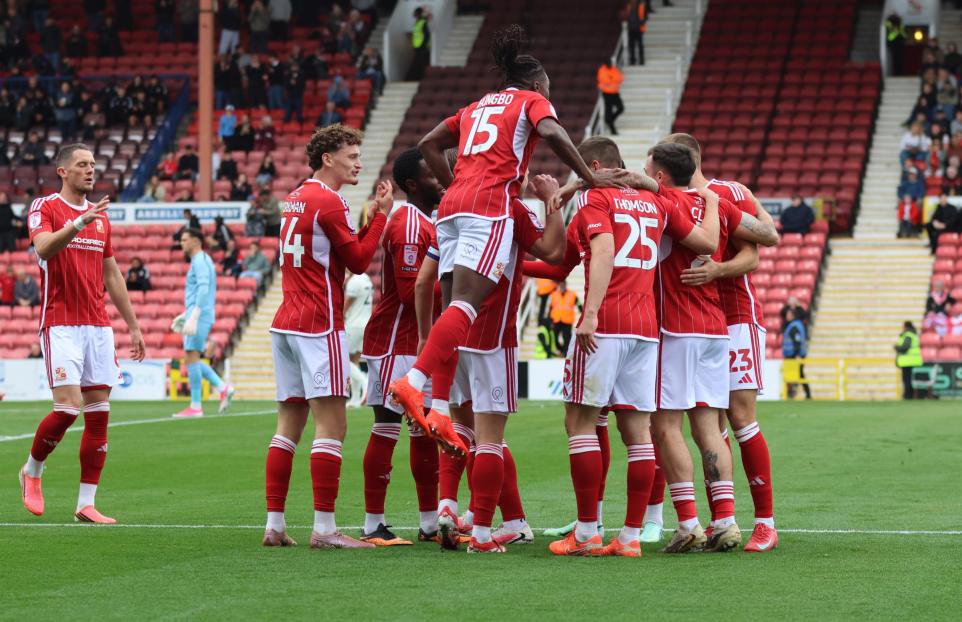 Swindon Town celebrate with Aaron Drinan after he opened the scoring against Walsall <i>(Image: Shaun King)</i>
