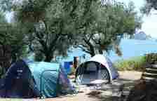Campers can see the sea and the island of Marathonissi from their tents