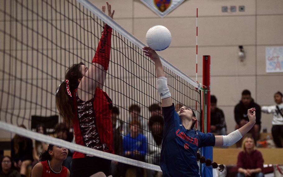 Natalia Ramos-Colon tries to get the ball over the net.