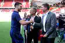 Declan Rice of England talks to former England players Steven Gerrard and Joe Cole prior to the UEFA EURO 2024 qualifying round group C match betwe...