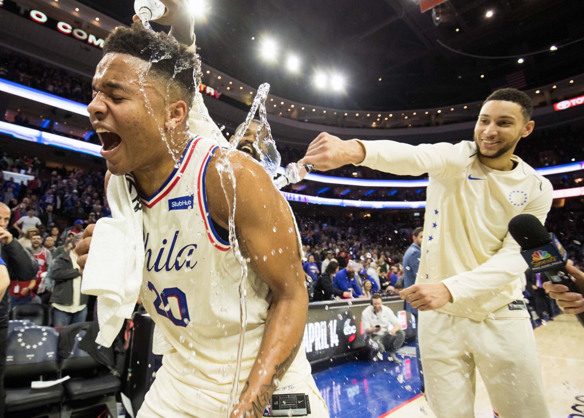 Apr 11, 2018; Philadelphia, PA, USA; Philadelphia 76ers guard Markelle Fultz (20) is doused with water by guard Ben Simmons (25) and center Amir Johnson (5) after recording his first triple double in a game against the Milwaukee Bucks at Wells Fargo Center. Mandatory Credit: Bill Streicher-USA TODAY Sports