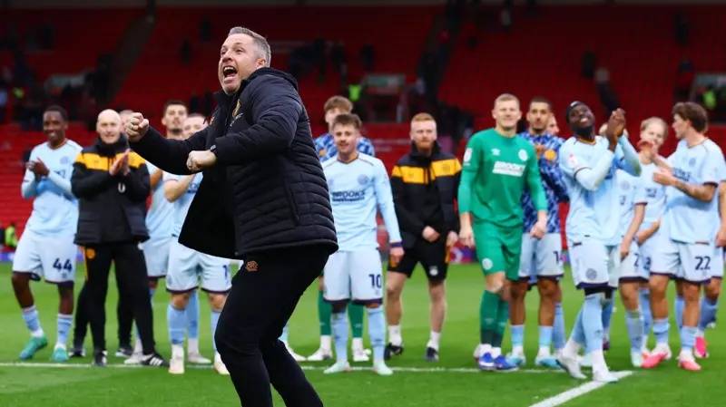 Neil Harris celebrates a win for Cambridge