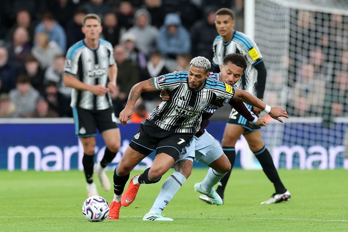  Joelinton of Newcastle United is challenged by Boubacar Kamara of Aston Villa 