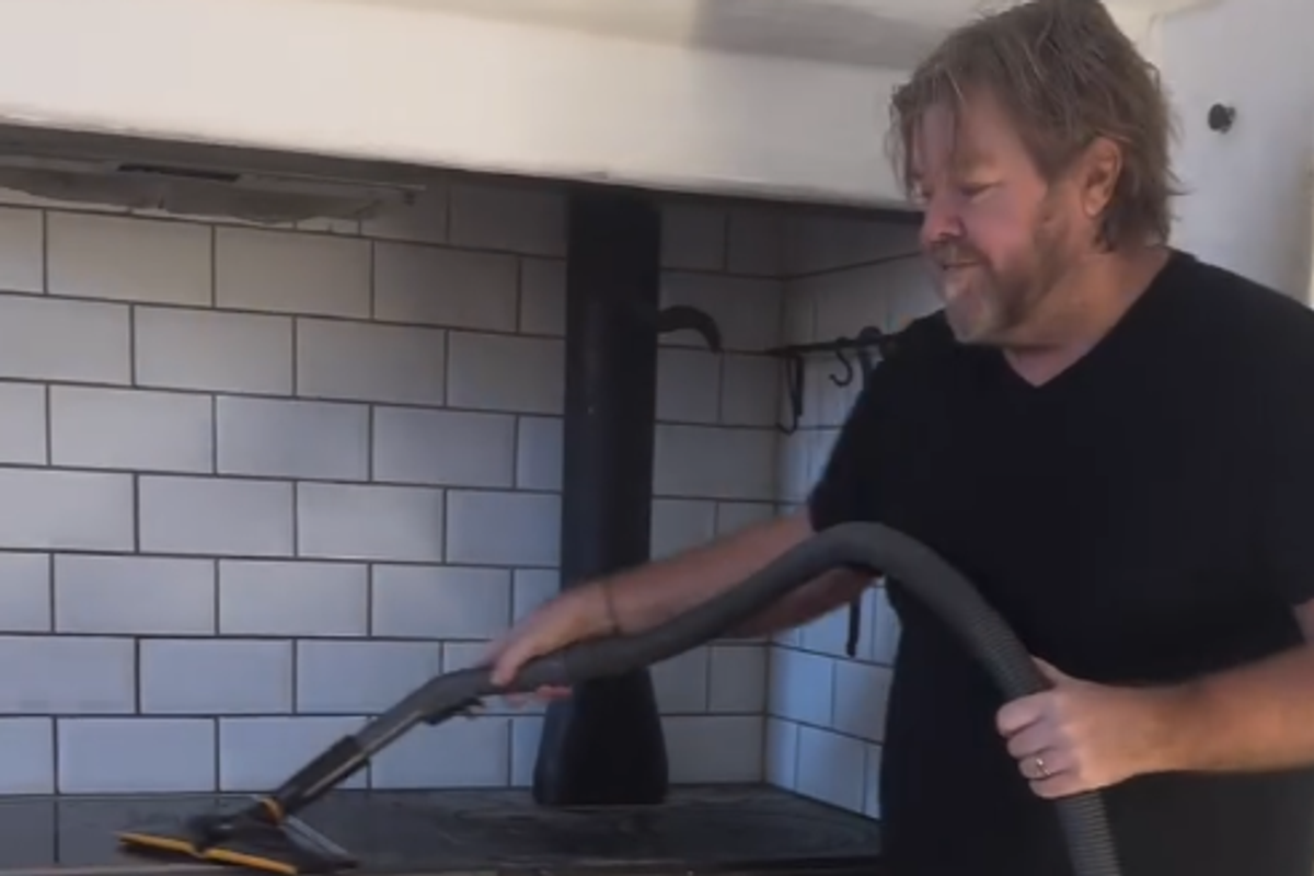 Tomas Brolin showing off one of his vacuum cleaners