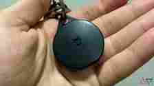 The Pebblebee Clip Bluetooth tracker held in a hand