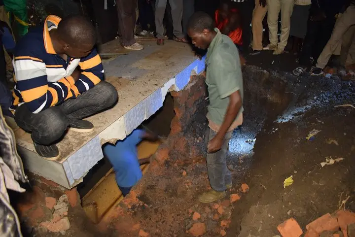 Some youths involved in exhumation of the buried body at Kobwana village, North Kanyabala Sub-location in Homa Bay Town constituency on January 10,2022.