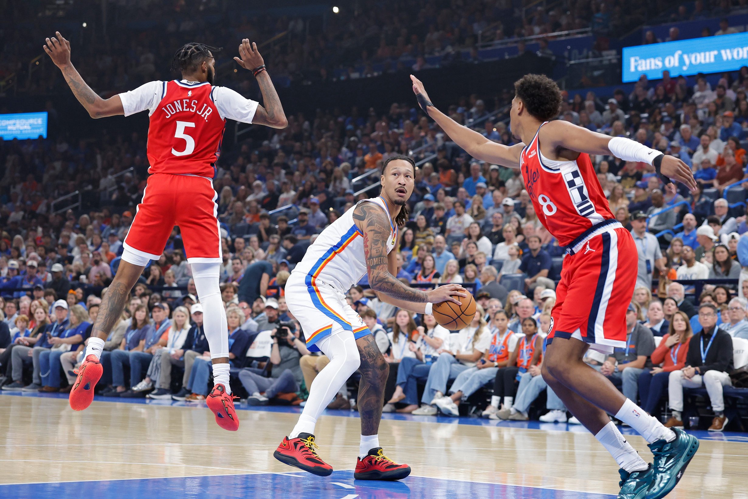 Oct 25, 2026; Oklahoma City, Oklahoma, USA; Oklahoma City Thunder forward Jaylin Williams (6) moves the ball between Los Angeles Clippers forward Derrick Jones Jr. (5) and forward Baba Miller (18) during the first half at Paycom Center. Mandatory Credit: Alonzo Adams-Imagn Images