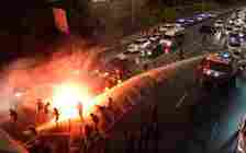 Anti-government protesters block Ayalon Highway in Tel Aviv as police use water cannons against them on July 6, 2024. (Lior Segev/Israeli Pro-Democracy Protest Movement)