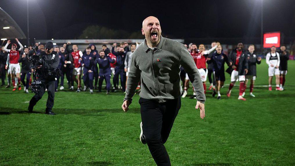 Fleetwood Town boss Matt Lawlor celebrates their win against Arsenal