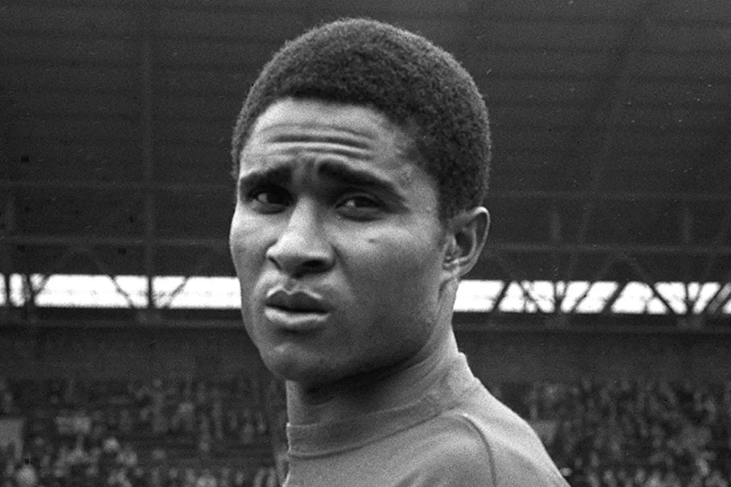 Eusébio looks at the camera.
