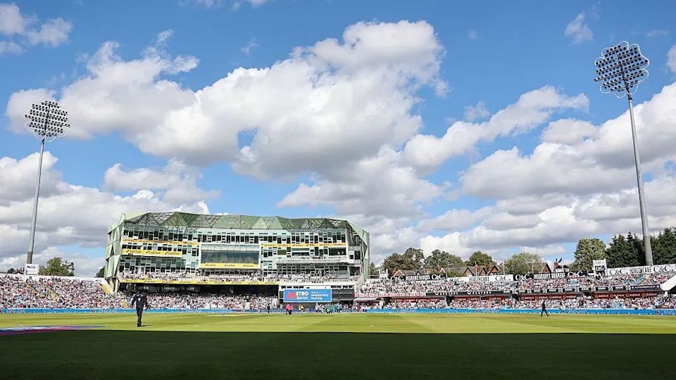 Headingley Cricket Ground with the pavilion in the centre and floodlights either side.