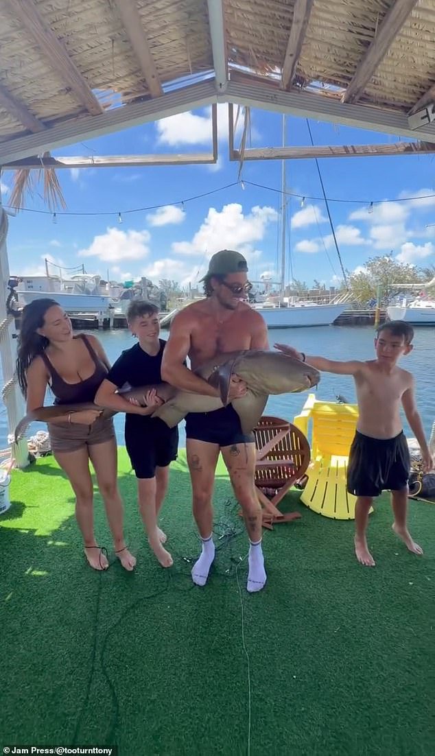 Anthony finished the video by showing himself, CeCe, and two young boys posing with the nursing shark before they released it back into the water