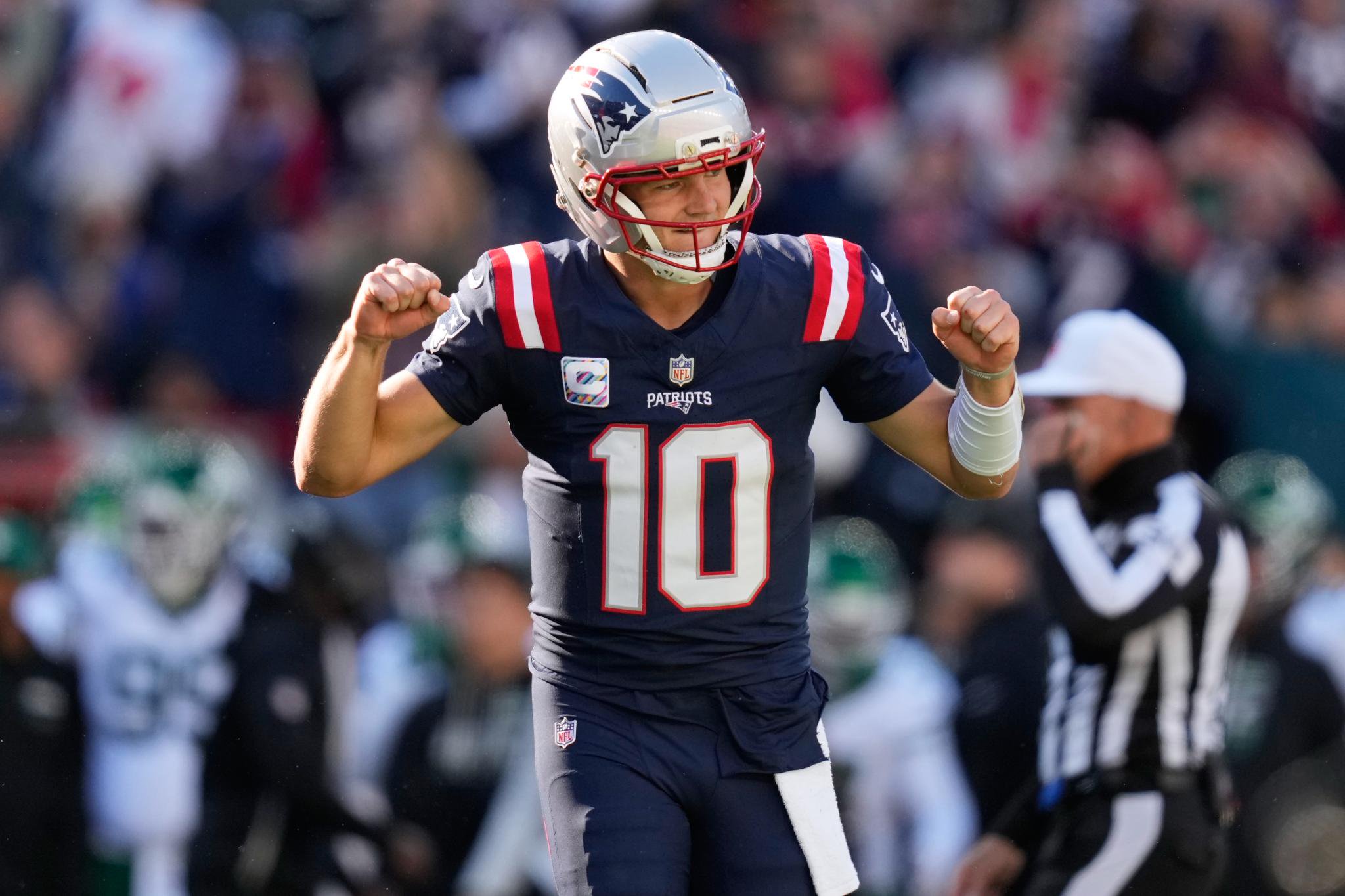 New England Patriots quarterback Drake Maye celebrates on the field.