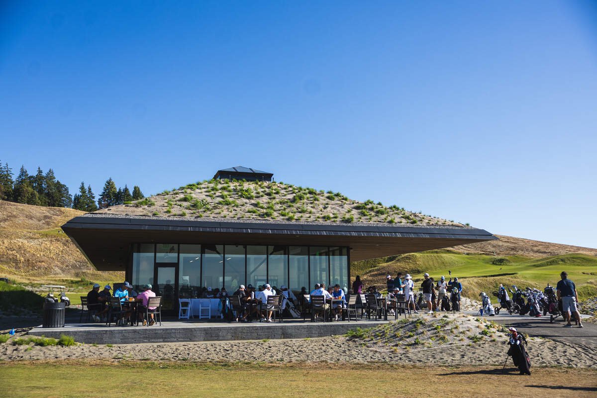 The Landing at Chambers Bay, a new cafe and bar, opens Oct. 10, 2025, at Chambers Bay Golf Course and Chambers Creek Regional Park. SHKS Architects designed the permanent structure to blend with the berms of the Links-style course that surrounds it.
