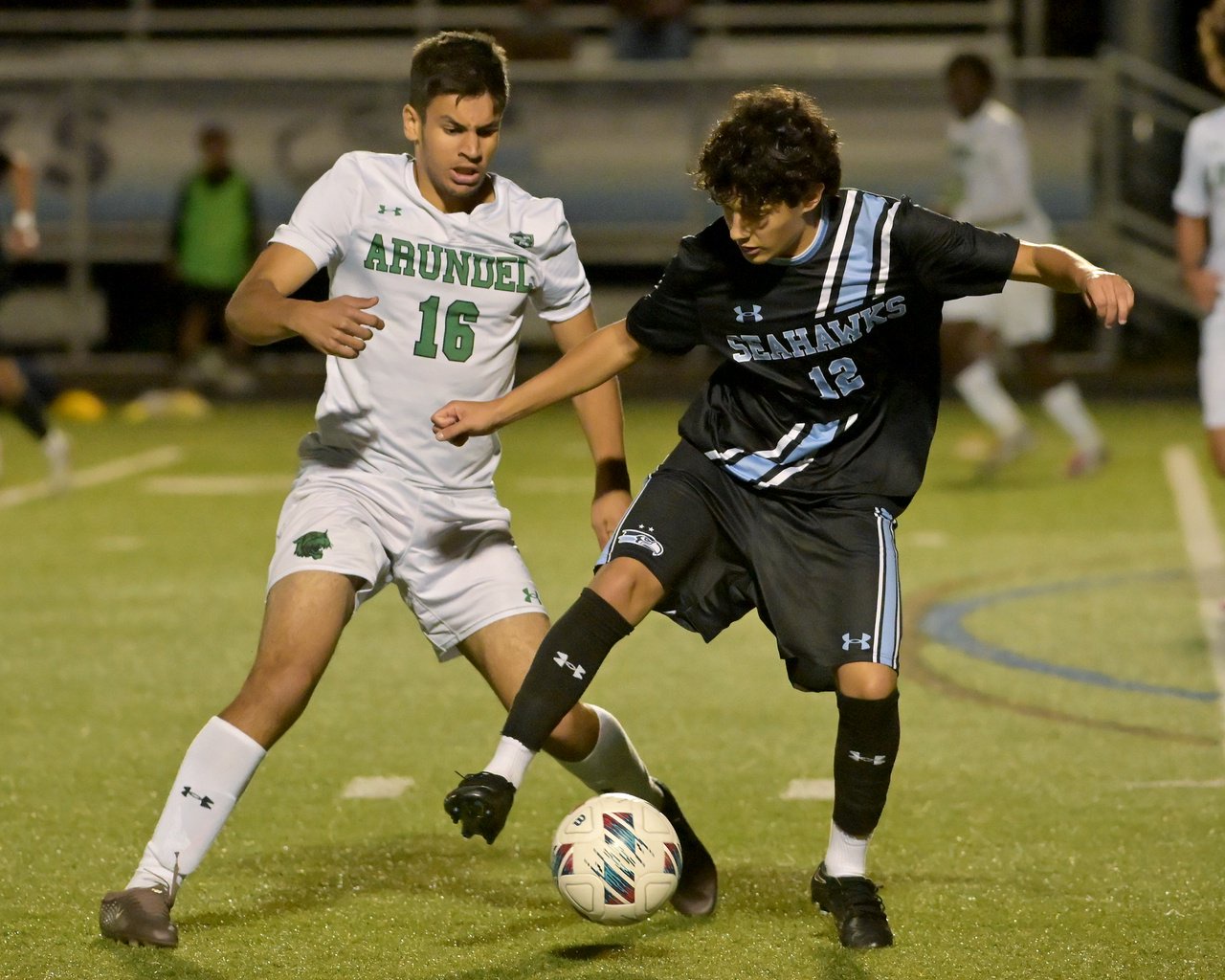 Arundel Wildcats Adnane Baali #16 and South River Seahawks Luis Alberto-Aquino #12 battle for the ball during the first half. The visiting Arundel Wildcats defeat the South River Seahawks, 2-1, in overtime in an MPSSAA Class 3A East II quarterfinal boys soccer game Wednesday evening. (Paul W. Gillespie/Staff)