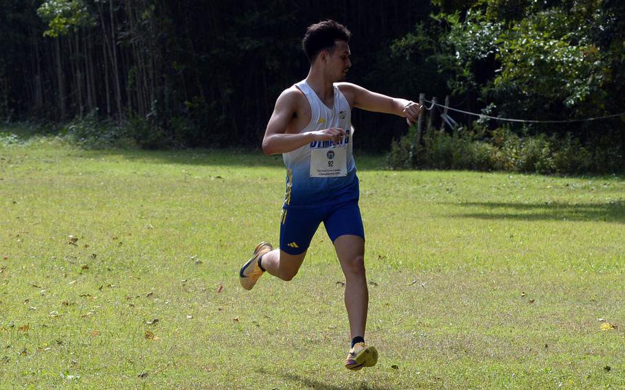 Noah Takato checks his time right before the finish.