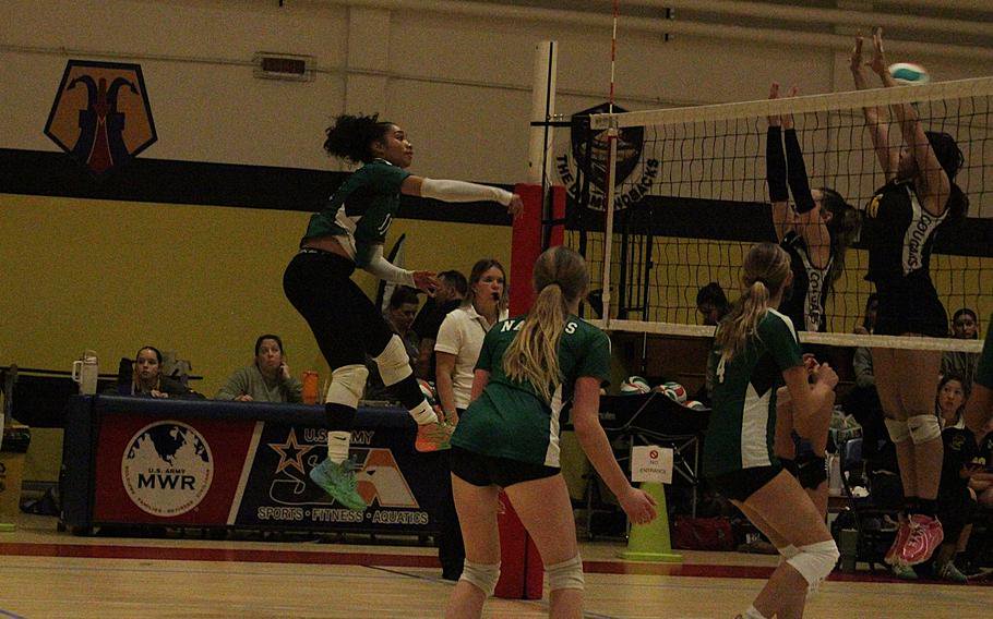 Naples girls’ volleyball team freshman outside hitter Tinui Talio spikes the ball past Vicenza’s front line during a semifinal game of the 2026 DODEA-Europe volleyball championships Division II tournament at the Ederle Fitness Center gym on Caserma Ederle in Vicenza, Italy, on Friday, Oct. 30, 2026. 

Chad Garland/Stars and Stripes