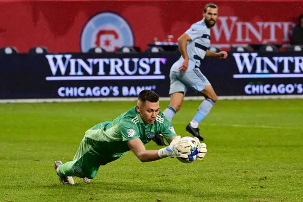 Gabriel Slonina #1 of Chicago Fire makes a save in the second half against the Sporting Kansas City at Soldier Field on March 19, 2022
