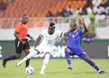 Fashion Sakala of Zambia prepares to have a shot at goal as he is pressured by Mzamiru Yasin of Tanzania during the TotalEnergies CAF Africa Cup of...