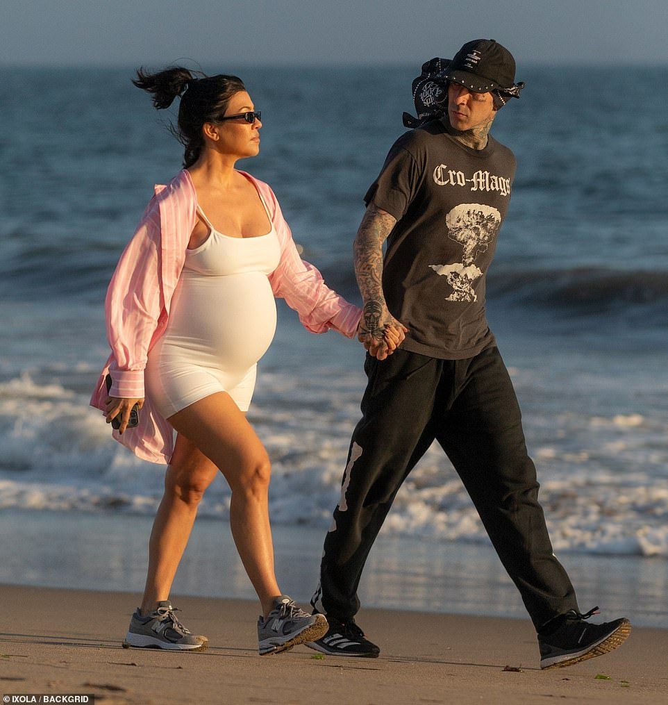 Maternity style: The Poosh founder showed off her pregnancy curves in a tight-fitting white maternity bodysuit and a stylish pink shirt