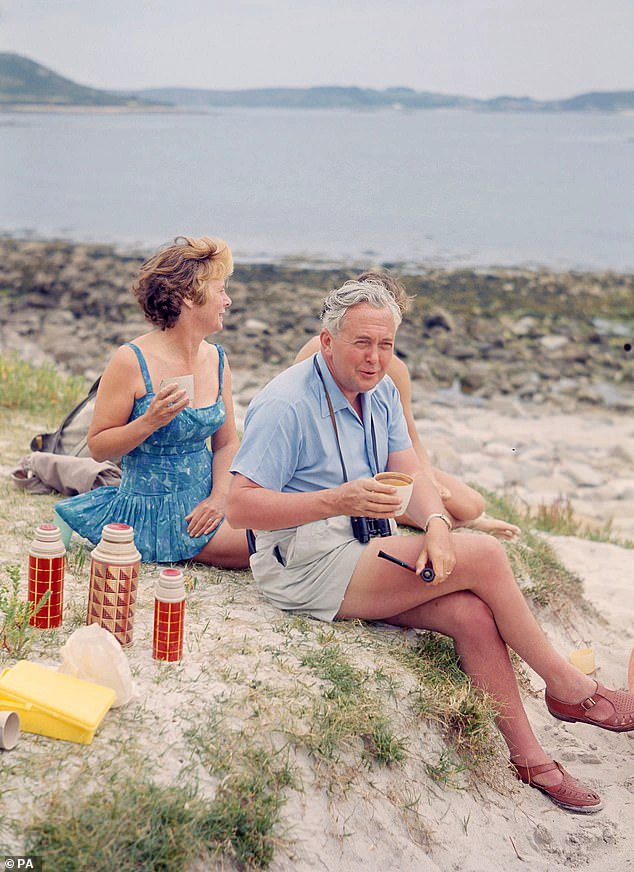 Wilson and his wife Mary picnic on the beach during a holiday to the Isles of Scilly