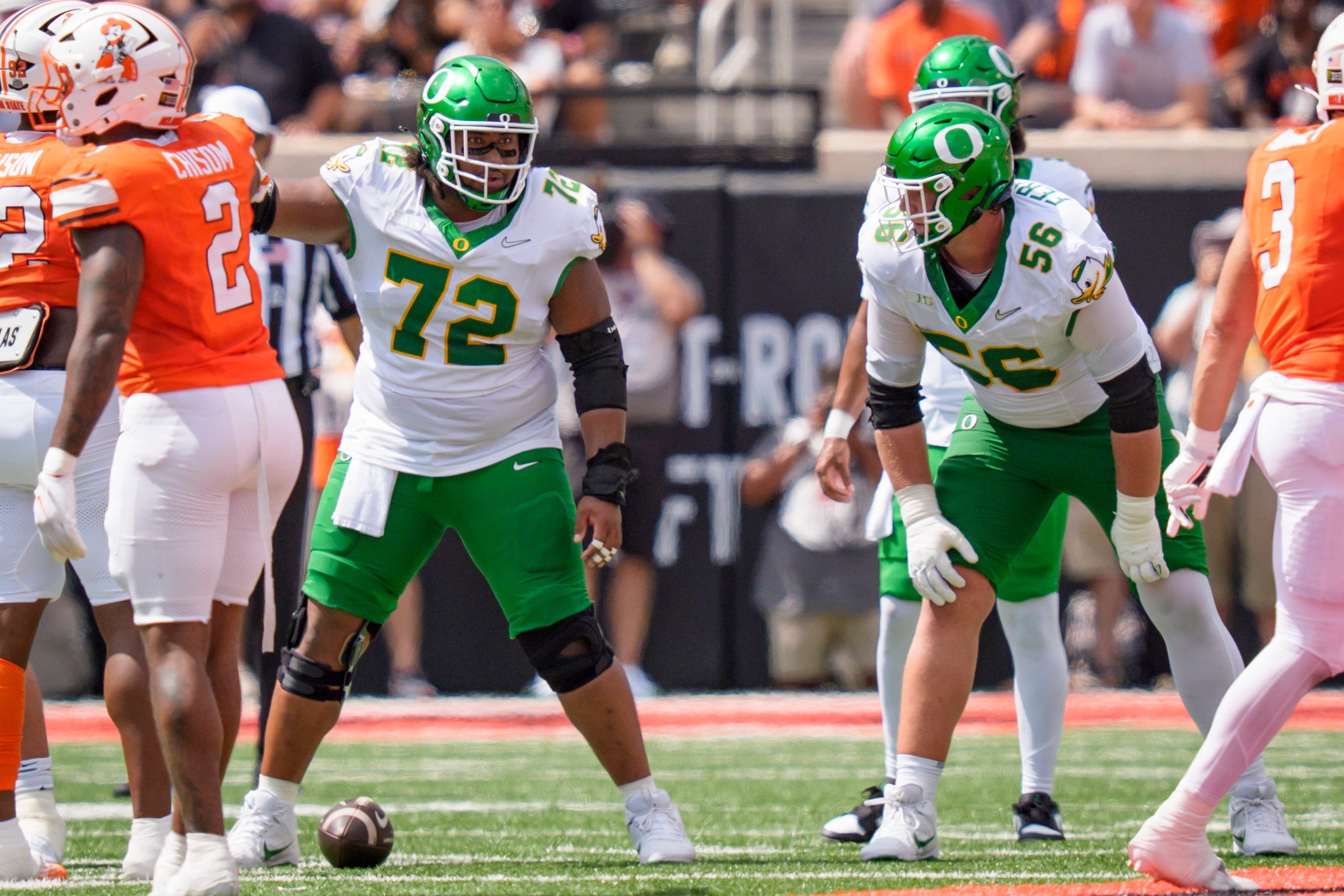 Oregon offensive lineman Trent Ferguson, right, and Oregon offensive lineman Iapani Laloulu line up as the Oregon Ducks face the Oklahoma State Cowboys on Sept. 12, 2026, at Boone Pickens Stadium in Stillwater, Oklahoma.