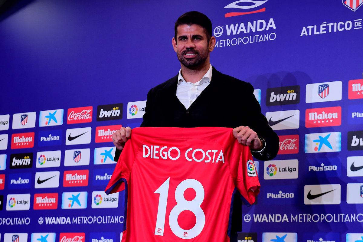 Atletico Madrid's Spanish forward Diego Costa poses with his jersey during his welcoming ceremony at the Wanda Metropolitan Stadium
