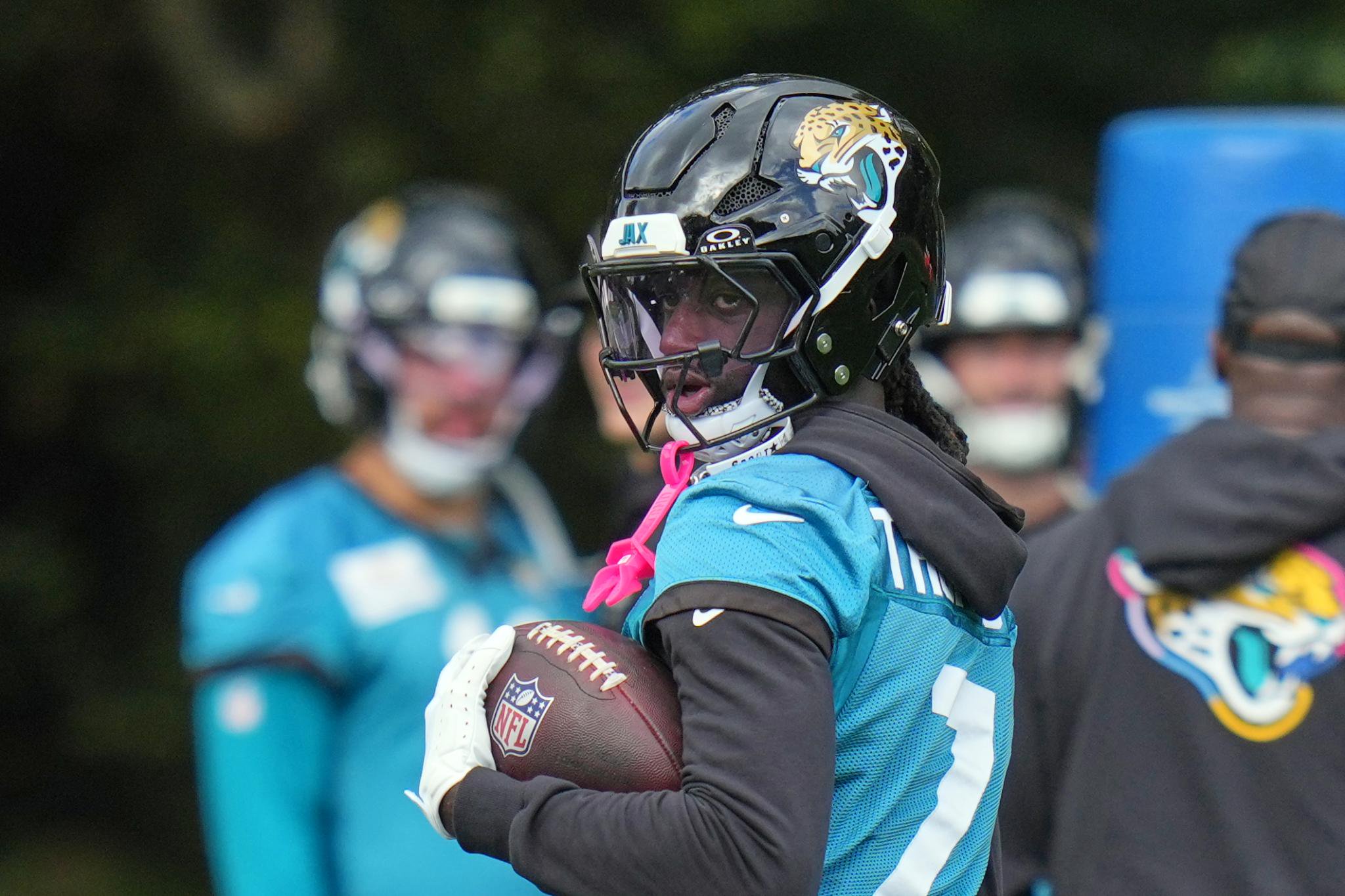 Jacksonville Jaguars wide receiver Brian Thomas Jr. holds a football during practice.