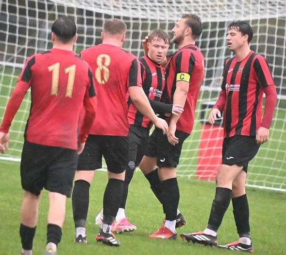 Alcester Town players celebrate one of their four goals against Shortwood. Photo: Phil Britt