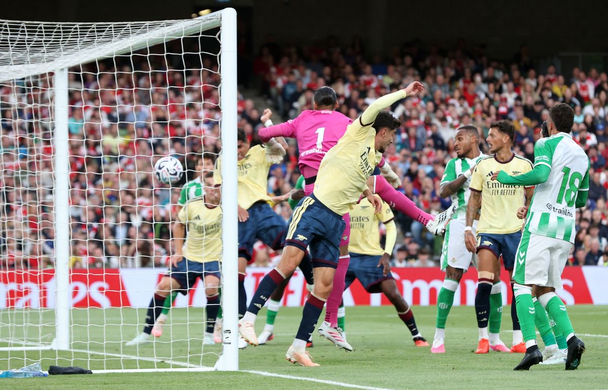 Real Betis' Spanish goalkeeper #01 Alvaro Valles concedes a goal from Arsenal's Ecuadorian defender #05 Piero Hincapie during the friendly pre-season football match between Arsenal and Real Betis, at the Aviva Stadium in Dublin, Ireland on August 5, 2026.  (Photo by Paul Faith/AFP via Getty Images)