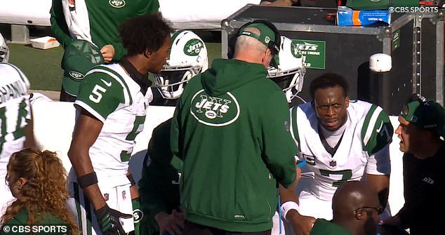 New York Jets wide receiver Garrett Wilson (left) appeared to holler at quarterback Geno Smith (right) and some coaches during Sunday's frustrating loss to the Miami Dolphins