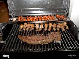 Sausages chicken and fillet cooking on barbeque Mombasa Kenya Stock Photo -  Alamy